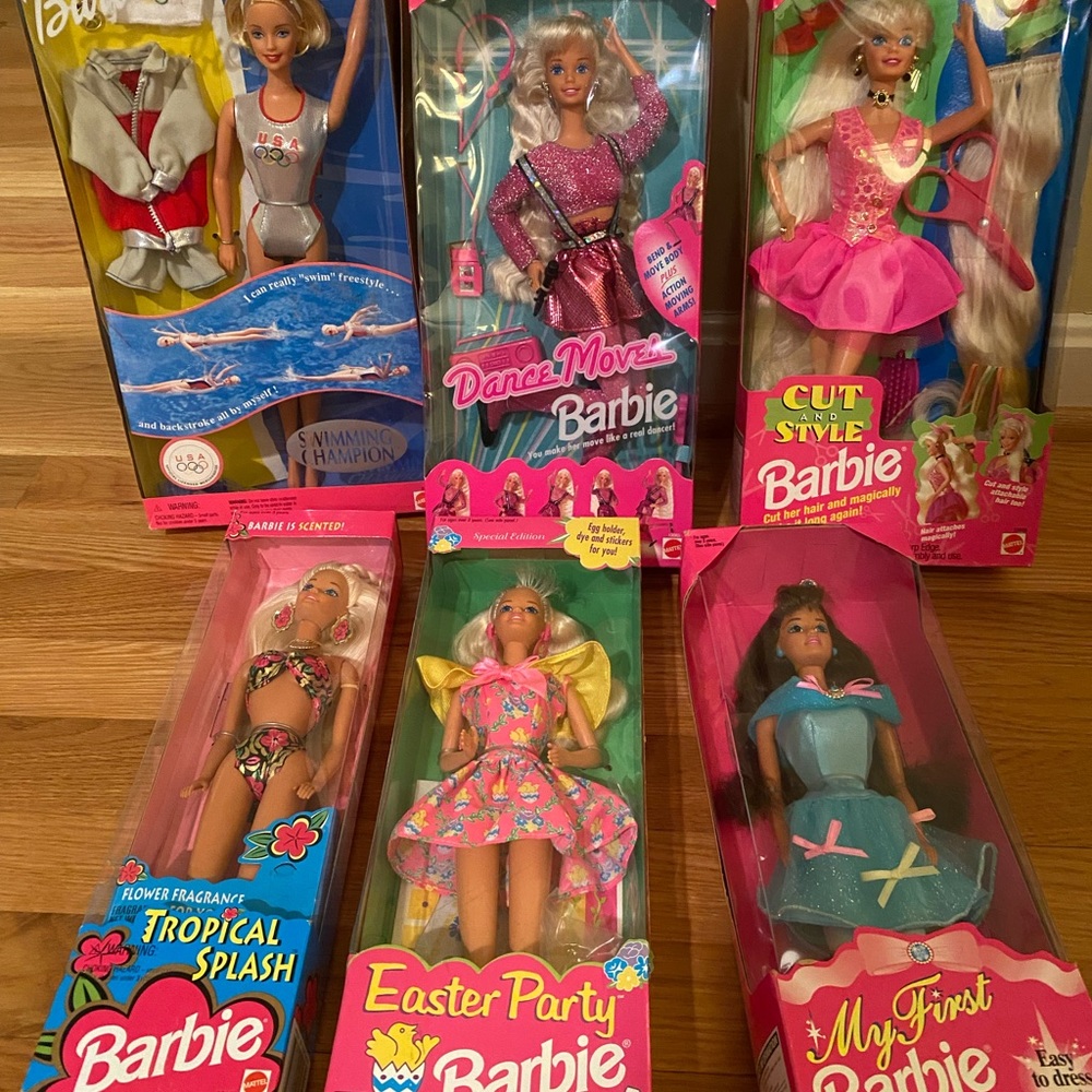 Collection of 6 Barbie dolls. Unopened and never been used. Circa 1996.
